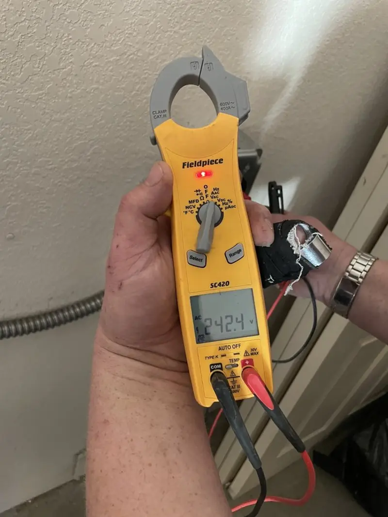 Voltage testing with clamp meter during Outlet Installation in Hermiston